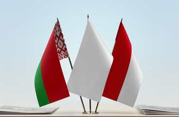 Flags of Belarus and Monaco with a white flag in the middle