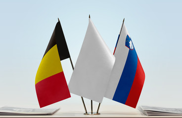 Flags of Belgium and Slovenia with a white flag in the middle