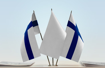 Two flags of Finland with a white flag in the middle