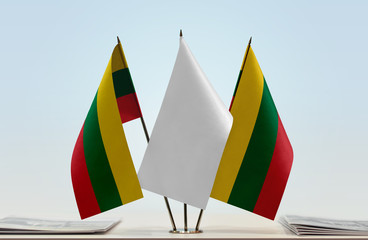 Two flags of Lithuania with a white flag in the middle