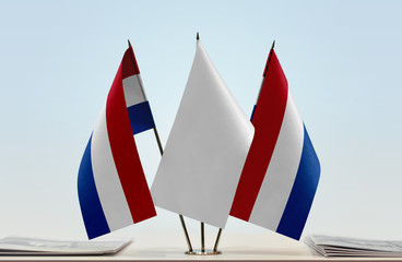 Two flags of Netherlands with a white flag in the middle