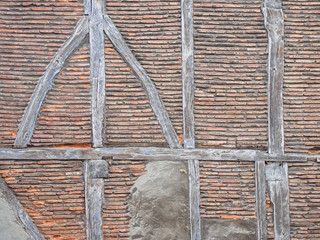 Ancient timber framing (post-and-beam) brick wall background
