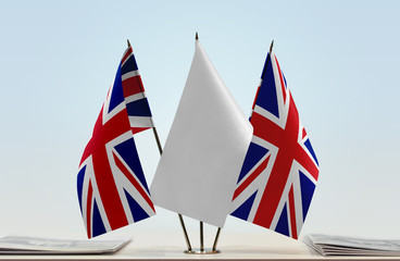 Two flags of Great Britain with a white flag in the middle