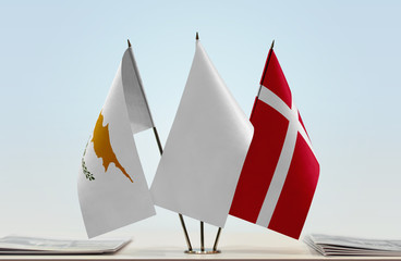 Flags of Cyprus and Denmark with a white flag in the middle