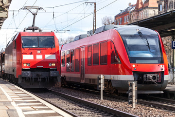Fototapeta na wymiar a german train passes a train station