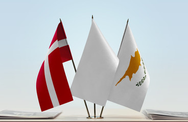 Flags of Denmark and Cyprus with a white flag in the middle