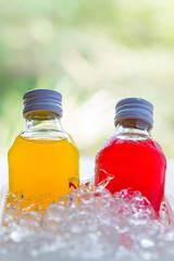 bottle with tasty drink in ice