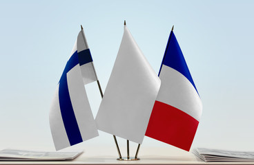 Flags of Finland and France with a white flag in the middle