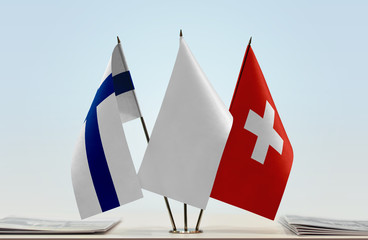 Flags of Finland and Switzerland with a white flag in the middle