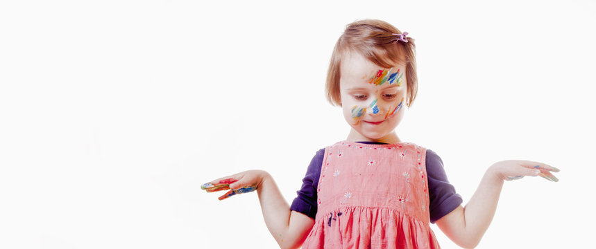 Beauty concept. Children's art makeup. Portrait of little beautiful children girl with colored face.