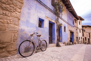 Fototapeta na wymiar Valderrobres, Spain - March 10, 2018: Old bicycle in the street, from Valderrobres a village in the Matarranya district is one of the most beautiful cities of Teruel in Spain