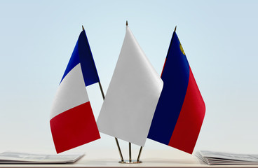 Flags of France and Liechtenstein with a white flag in the middle