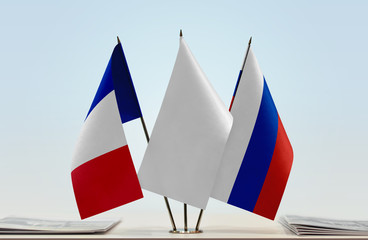 Flags of France and Russia with a white flag in the middle