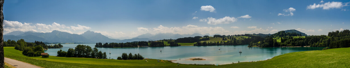 Fototapeta na wymiar Panoramic view over lake forggensee near fuessen in bayern germany