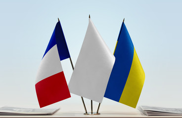 Flags of France and Ukraine with a white flag in the middle