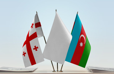 Flags of Georgia (country) and Azerbaijan with a white flag in the middle