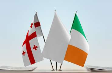 Flags of Georgia (country) and Ireland with a white flag in the middle