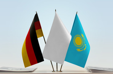 Flags of Germany and Kazakhstan with a white flag in the middle
