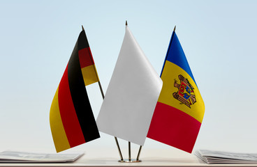 Flags of Germany and Moldova with a white flag in the middle