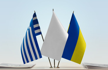 Flags of Greece and Ukraine with a white flag in the middle