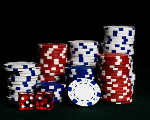 Stacks of poker chips representing a gambling win at a casino or poker or craps game.