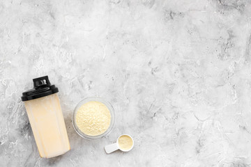 sport diet protein nutrition and fitness equipment on stone background top view mock up