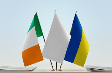 Flags of Ireland and Ukraine with a white flag in the middle