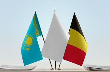 Flags of Kazakhstan and Belgium with a white flag in the middle