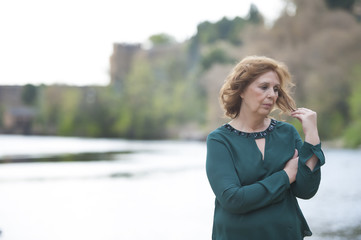 Grandmother posing near the river