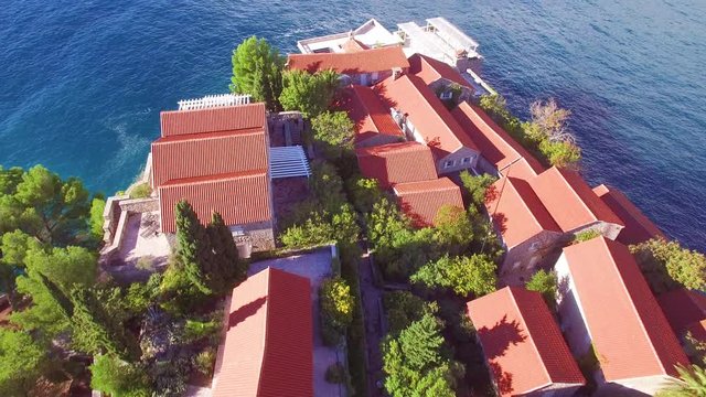 Remarkable aerial shot over the beautiful Sveti Stefan island in Montenegro.