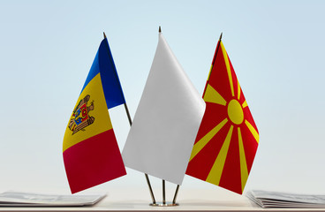 Flags of Moldova and Macedonia with a white flag in the middle