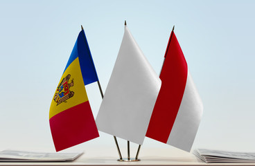 Flags of Moldova and Monaco with a white flag in the middle