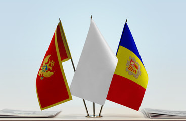 Flags of Montenegro and Andorra with a white flag in the middle