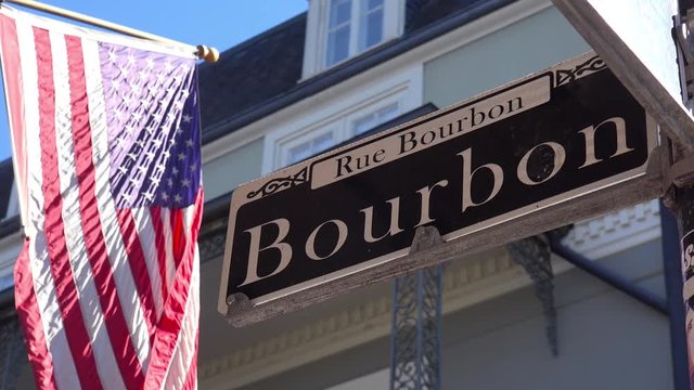 Bourbon Street sign, French Quarter, New Orleans with American flag.