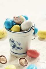 Colorful  Speckled Easter eggs candies  on white background, selective focus