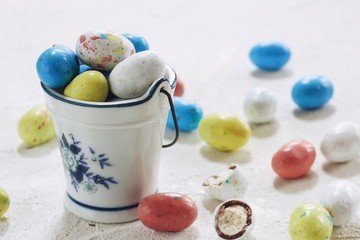 Colorful  Speckled Easter eggs candies  on white background, selective focus