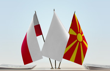 Flags of Poland and Macedonia with a white flag in the middle