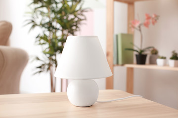 Stylish lamp on table