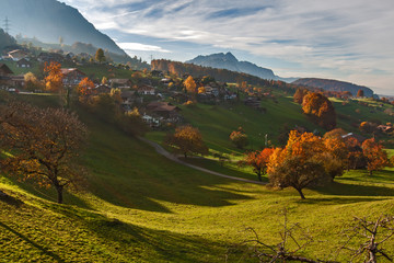 Autumn view of near Lake Thun and typical Switzerland village near town of Interlaken, canton of...