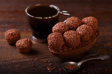 Chocolate egg with filling for Easter on wooden background