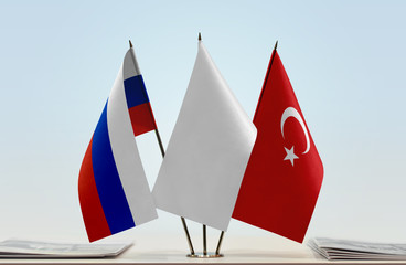 Flags of Russia and Turkey with a white flag in the middle