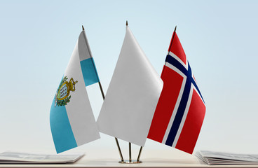 Flags of San Marino and Norway with a white flag in the middle