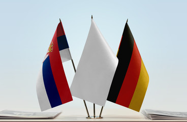 Flags of Serbia and Germany with a white flag in the middle