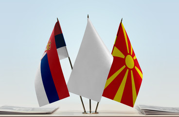 Flags of Serbia and Macedonia with a white flag in the middle