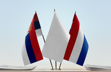 Flags of Serbia and Netherlands with a white flag in the middle