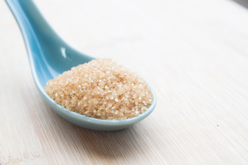 Brown sugar on spoon, Diabetes, Unhealthy diet concept