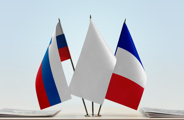 Flags of Slovenia and France with a white flag in the middle