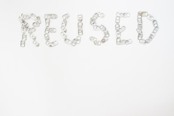 Donated material, aluminum beverage cans made an artificial leg loop, spiral lid cover drinking water, Reused concept