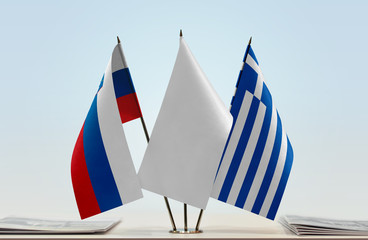 Flags of Slovenia and Greece with a white flag in the middle