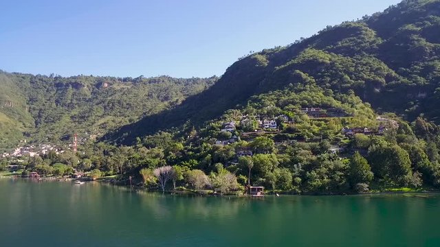Aerial over the shoreline of Lake Amatitlan lake in Guatemala.